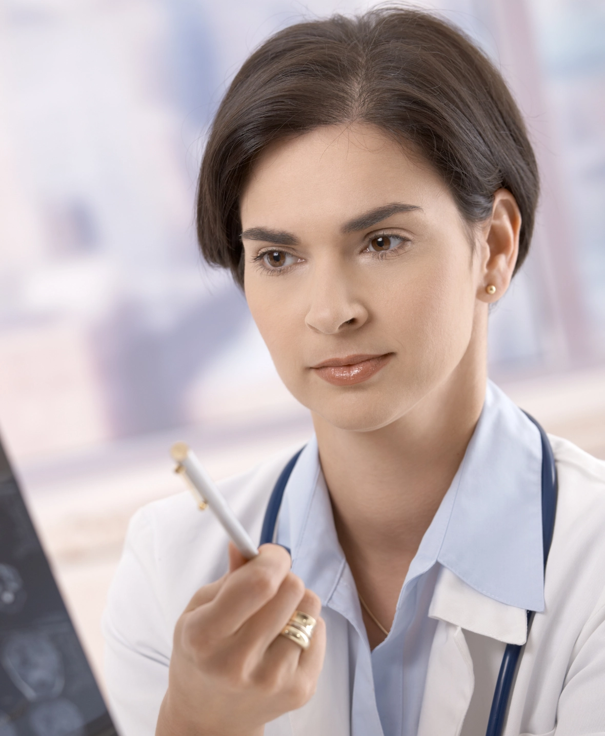 Doctor examining a patient for causes of facial deformity requiring urgent care like trauma or infections.